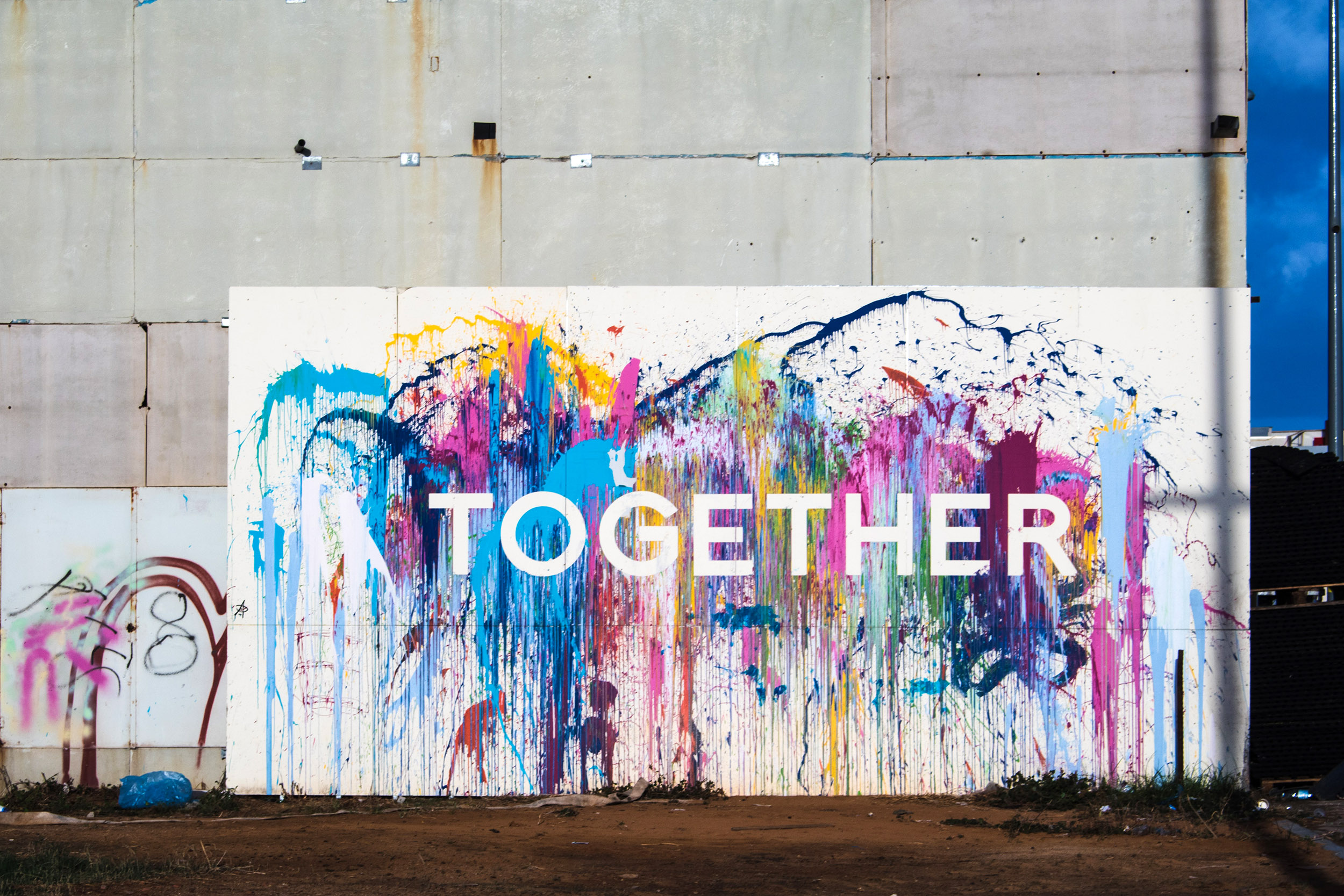 Mural with paint splashes and the word together